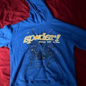 Vibrant Blue Hoodie with Spider Web Graphic